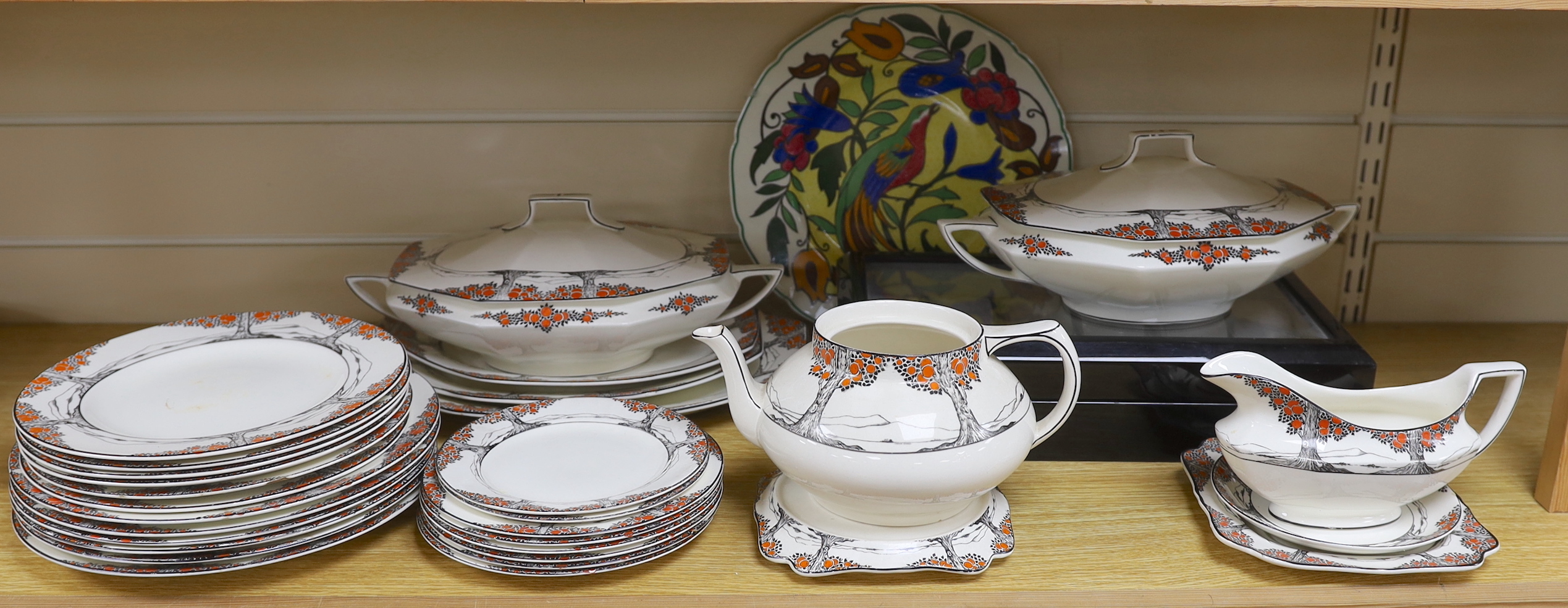 A Crown Ducal orange tree pattern part dinner set including tureens, side plates and jug, together with a Royal Doulton plate, largest 32cm wide